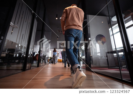 Business team in a modern open space startup office walking together. Diverse group of businesspeople smiling while having a discussion. Successful mixed race colleagues collaborating on a new project 123324567