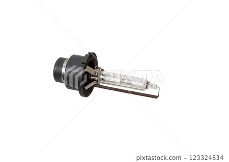 Automotive electric parts - New white 12v xenon headlight car lamp on the white background - gas discharge lamp. Spare parts auto catalog 123324834