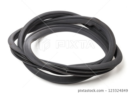 Rolled up black rubber sealant for elements of the car body, doors or trunk, for noise insulation, thermal and sound, preventing heat loss in the car interior. Sealing gasket for repair in a workshop 123324849
