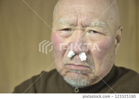 Bearded old man suffering from hay fever 123325180