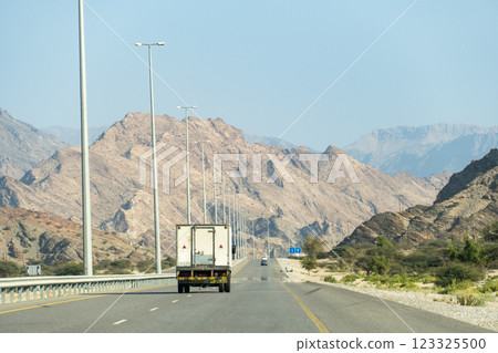 A driving view of Oman's magnificent rocky mountains A driving view of Oman's magnificent rocky mountains 123325500