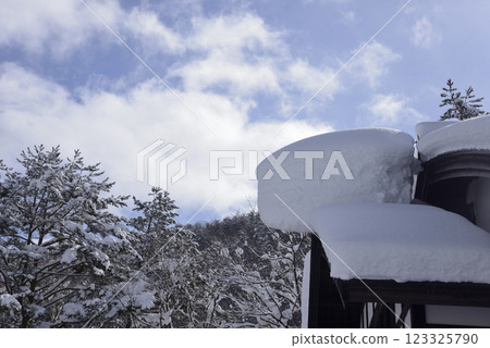 Snow cornice on the roof Snow cornice on the roof 123325790