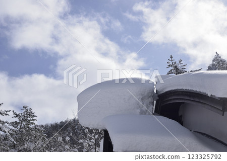 Snow cornice on the roof Snow cornice on the roof 123325792