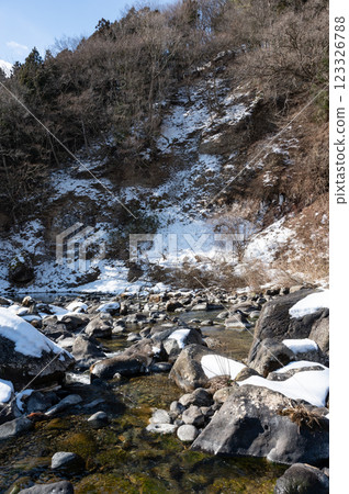 Snow piled river Snow piled river 123326788