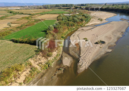 Aerial view of a huge sand riverbank island on a river 123327087