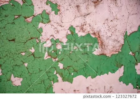 Chipped and peeling lead based paint on an old wall. 123327672