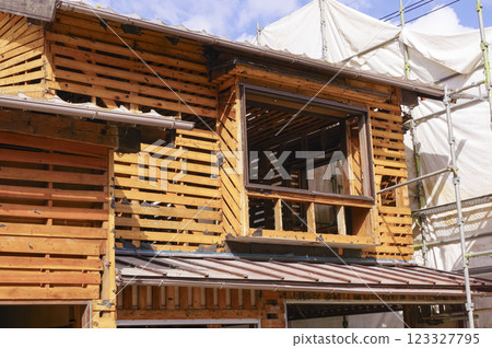 Wooden house under demolition Wooden house under demolition 123327795