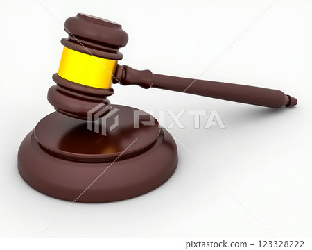 Judge's gavel resting on a wooden sound block symbolizes justice and legal authority in a courtroom setting 123328222