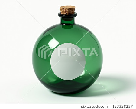 Unique green glass bottle with a cork stopper showcasing a circular white label for customization in a bright setting 123328237