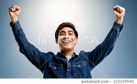 A happy man pumping his fist in the air (AI-generated image) 123329540
