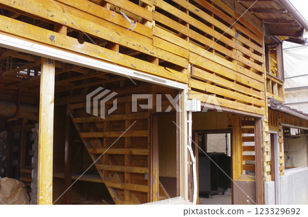 Wooden house under demolition 123329692