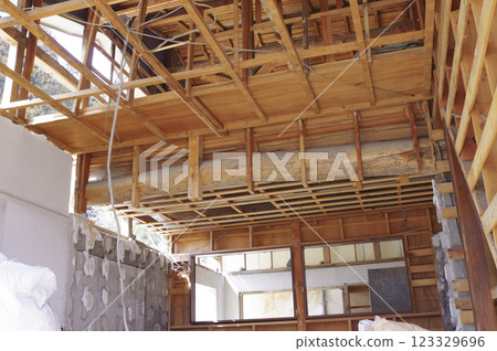 Wooden house under demolition Wooden house under demolition 123329696