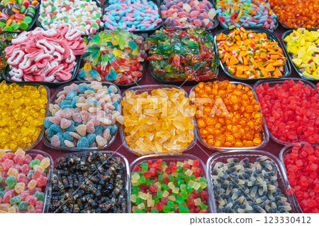 assortment of colorful marmalade and chewable candies on the counter at a candy store in oriental market 123330412