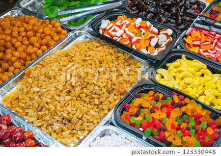 assortment of dried fruits, sweets, candies and marmalade on Asian market in Asia 123330448