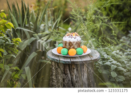 Easter cake and eggs on the old wooden table. Easter cake and eggs on the old wooden table. 123331175