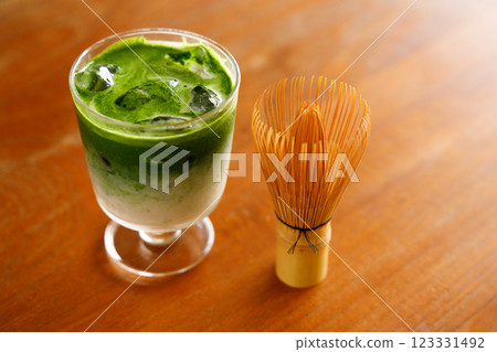 Iced matcha latte, authentic japanese matcha latte drink in a glass. Iced matcha latte, authentic japanese matcha latte drink in a glass. 123331492
