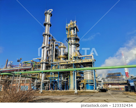 Steel structure is under construction on the construction site against a blue sky backdrop Steel structure is under construction on the construction site against a blue sky backdrop 123332434