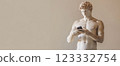Antique statue with modern smartphone 123332754