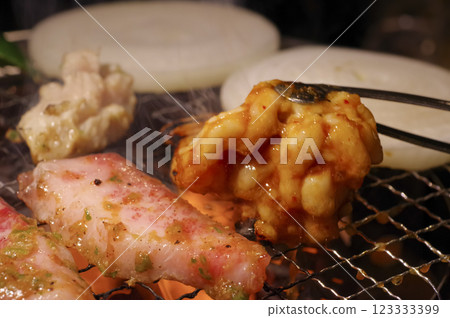 Image of grilling meat at a yakiniku restaurant Image of grilling meat at a yakiniku restaurant 123333399