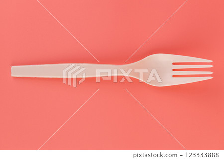 soft pink background pair of plastic white forks disposable tableware eco technology reusable care for the planet picnic set 123333888