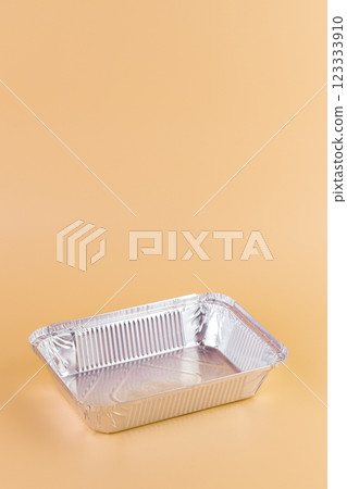top shot on a soft yellow background lie new kitchen foil rectangular baking trays modern technologies cleanliness in the kitchen practical use anti-flood system top shot on a soft yellow background lie new kitchen foil rectangular baking trays modern technologies cleanliness in the kitchen practical use anti-flood system 123333910