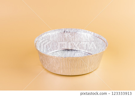 top shot on a soft yellow background lie new kitchen foil round baking molds modern technologies cleanliness in the kitchen practical use anti-flood system top shot on a soft yellow background lie new kitchen foil round baking molds modern technologies cleanliness in the kitchen practical use anti-flood system 123333913
