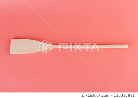 close-up on soft pink background lie new kitchen light wooden utensils forms spoons spatulas for teflon coating natural wood handmade different types of use 123333951