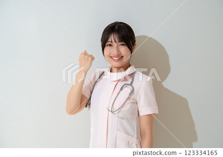 Female staff doing a fist pump 123334165