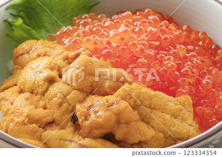 Delicious looking sea urchin and salmon roe bowl Delicious looking sea urchin and salmon roe bowl 123334354