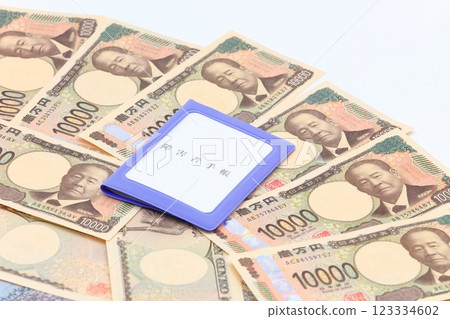 Image of a disability certificate and paper money 123334602