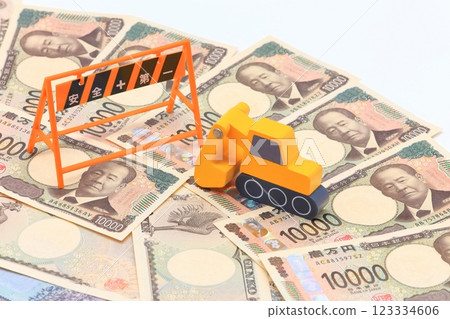 Image of heavy machinery and paper money 123334606