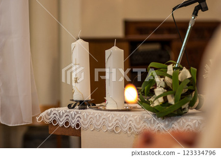 An Elegant and Beautiful Candlelit Ceremony Setting Featuring Gorgeous Floral Decor 123334796