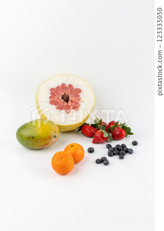 composition of tangerine and pamela fruits lies on a white background and strawberries blueberries and mangoes environmentally friendly product vitamin composition of tangerine and pamela fruits lies on a white background and strawberries blueberries and mangoes environmentally friendly product vitamin 123335050