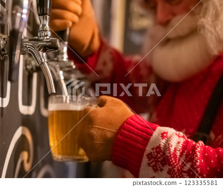 Santa Claus pouring beer from a keg at a bar. Santa Claus pouring beer from a keg at a bar. 123335581
