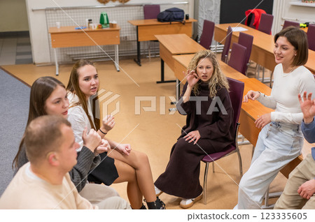 Hearing impaired students communicate during breaks at the university.  123335605