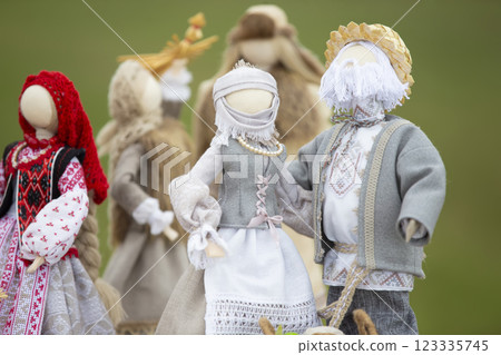 Ethnic Slavic national dolls imitating a man and a woman made of canvas fabric. 123335745