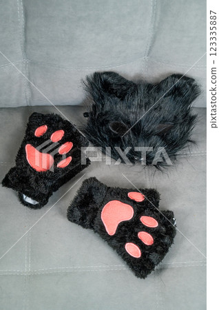 Cat costume on a gray sofa. Quadrober. Cat costume on a gray sofa. Quadrober. 123335887