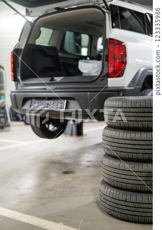 Changing tires for a car according to the season. Changing tires for a car according to the season. 123335986