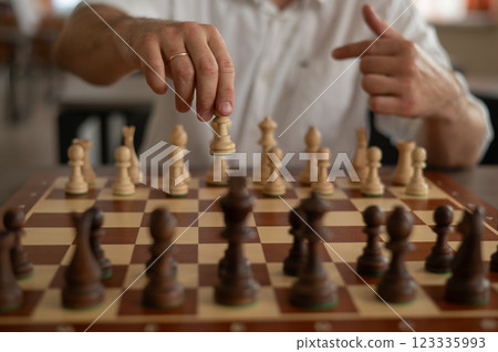 Close up of male hands playing chess. Close up of male hands playing chess. 123335993