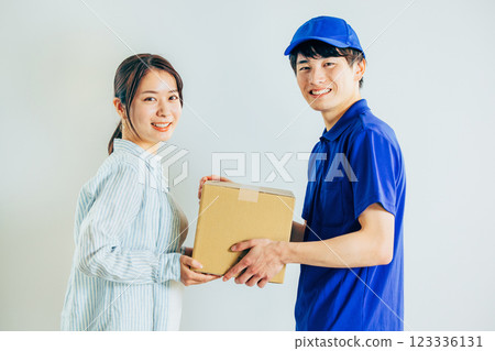 A courier driver delivering a package A courier driver delivering a package 123336131