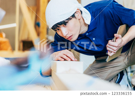 Young man working at a construction site 123336155