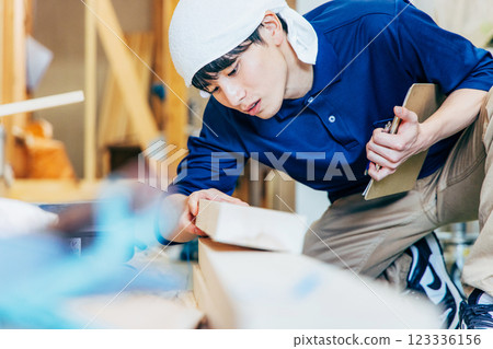 Young man working at a construction site Young man working at a construction site 123336156