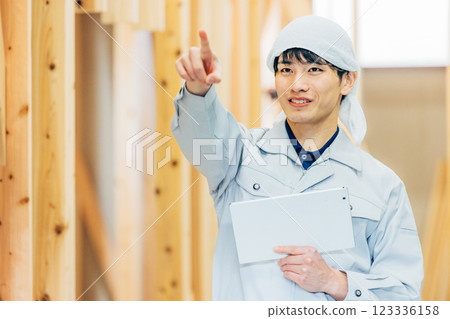 Worker with tablet on site 123336158