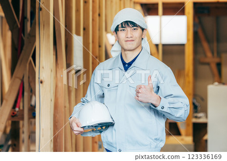 Workers at a wooden building construction site Workers at a wooden building construction site 123336169