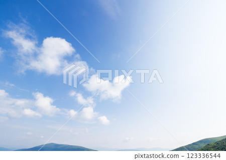 white cumulus clouds on a blue sky. wonderful nature background of atmosphere condition in day light. bright summer weather forecast. fresh air 123336544