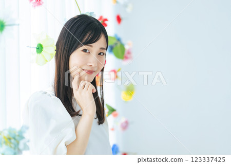 Portrait of a woman surrounded by flowers 123337425