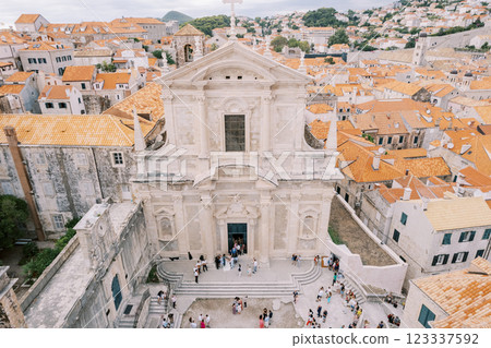 People leave the Church of St. Ignatius into the courtyard. Dubrovnik, Croatia. Top view People leave the Church of St. Ignatius into the courtyard. Dubrovnik, Croatia. Top view 123337592
