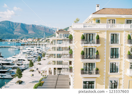 Terraces with green bushes in flower pots at the Regent Hotel. Porto, Montenegro 123337603