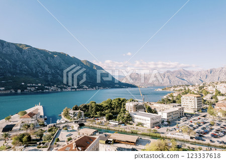 Parking lot with cars near modern houses on the shore of the bay. Kotor, Montenegro 123337618