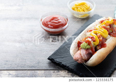 Sonoran hot dog. Traditional Mexican hot dog on wooden table 123338175